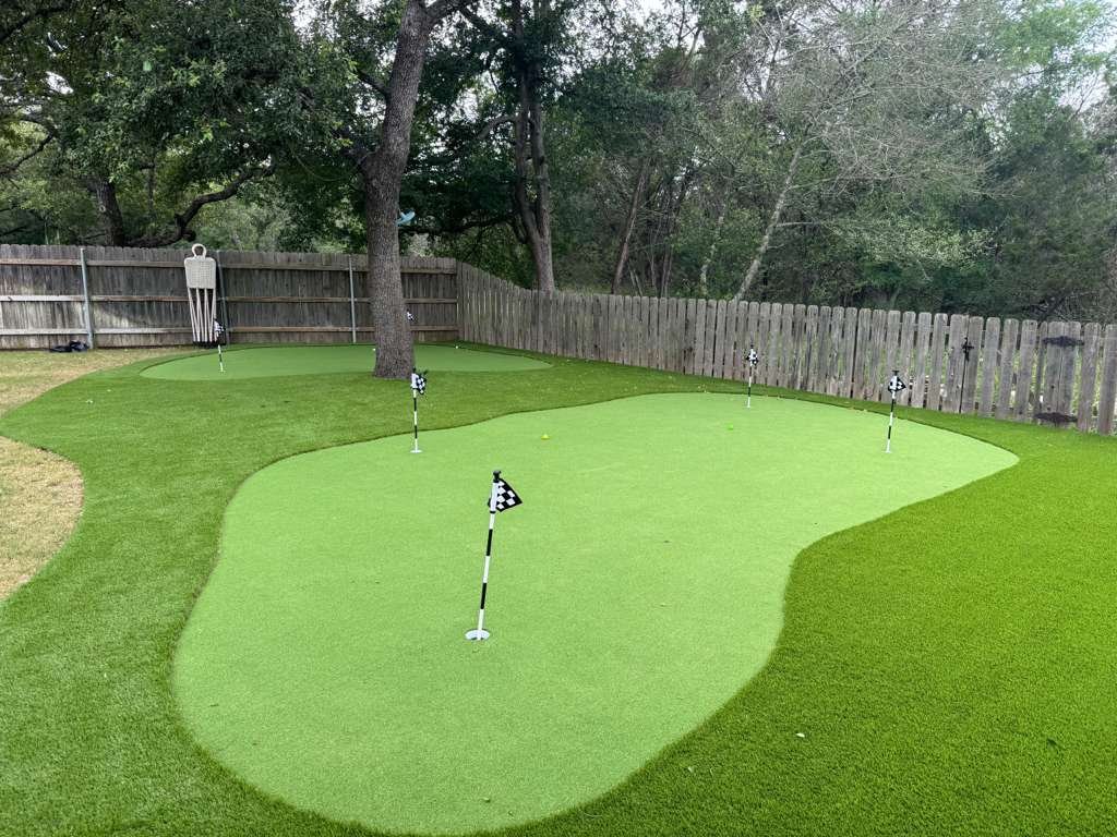 Backyard putting green artificial turf installation